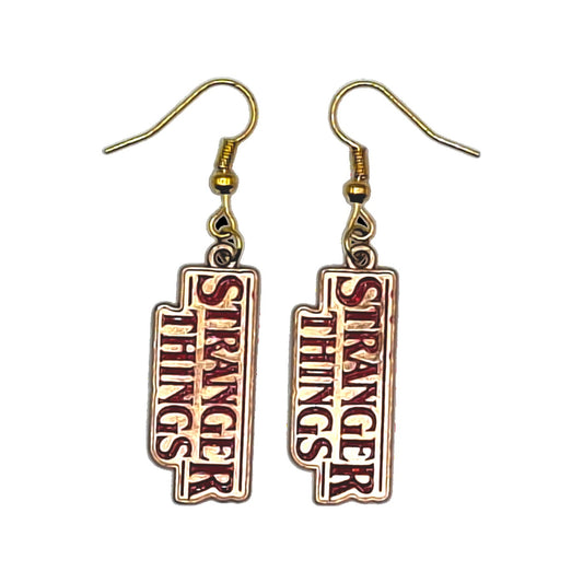 Stranger Things logo earrings in red and gold with gold-tone hooks on a white background