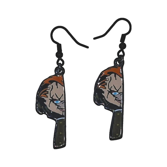 Chucky earrings with scarred-face butcher-knife motif and black hooks on a white background