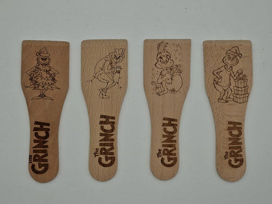Racloirs à raclette en bois gravés inspirés du Grinch